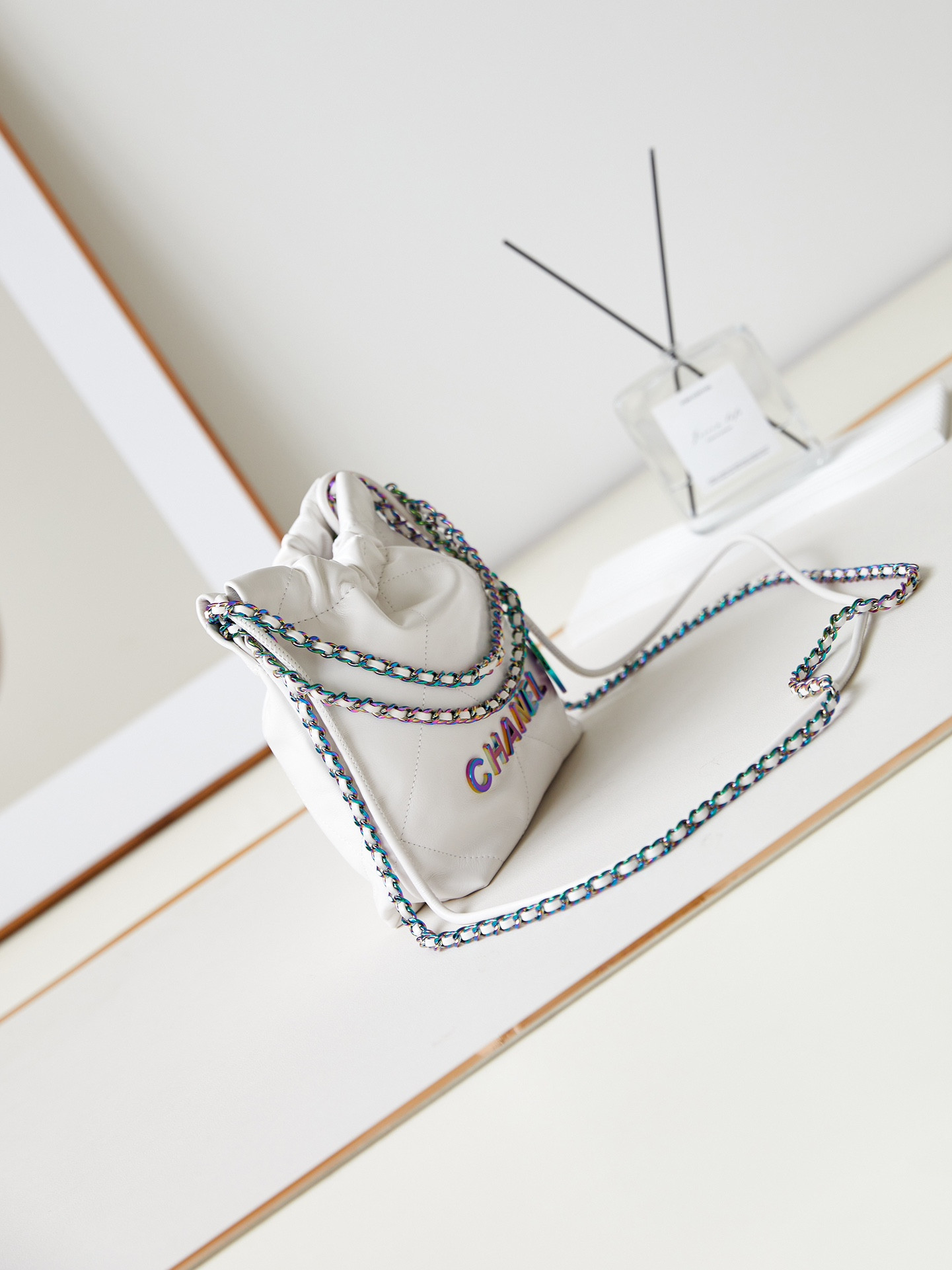 CHANEL 22 MINI HANDBAG Shiny Calfskin & Rainbow Metal White 7.8 × 7.4 × 2.3 in