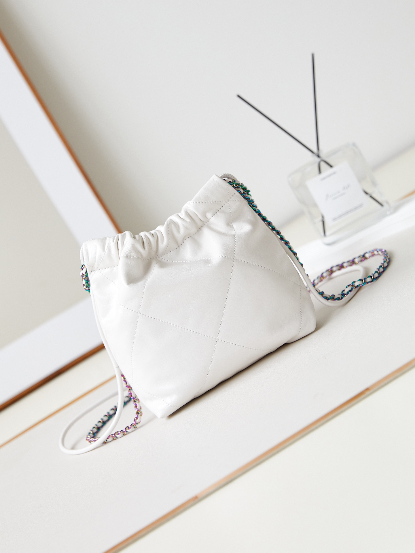 CHANEL 22 MINI HANDBAG Shiny Calfskin & Rainbow Metal White 7.8 × 7.4 × 2.3 in