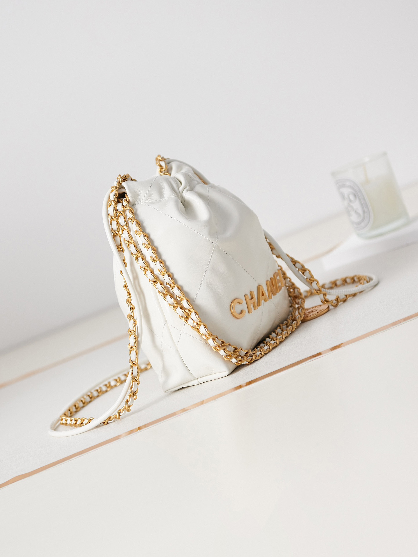 CHANEL 22 MINI HANDBAG Shiny Calfskin & Gold-Tone Metal white 7.8 × 7.4 × 2.3 in