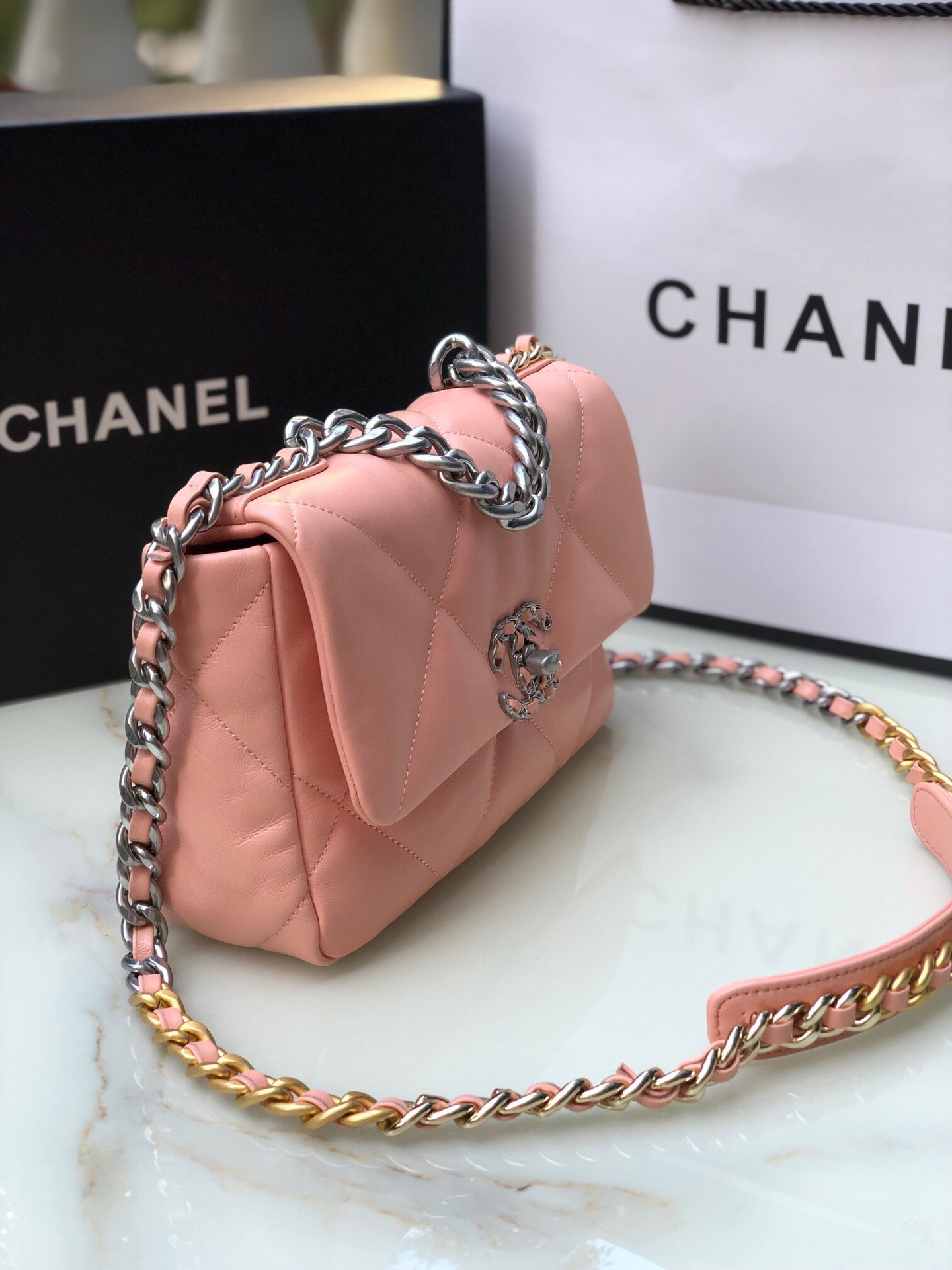 CHANEL 19 HANDBAG Shiny Leather, Gold-Tone, Silver-Tone & Ruthenium-Finish Metal Light Pink 6.2 × 10.1 × 3.5 in