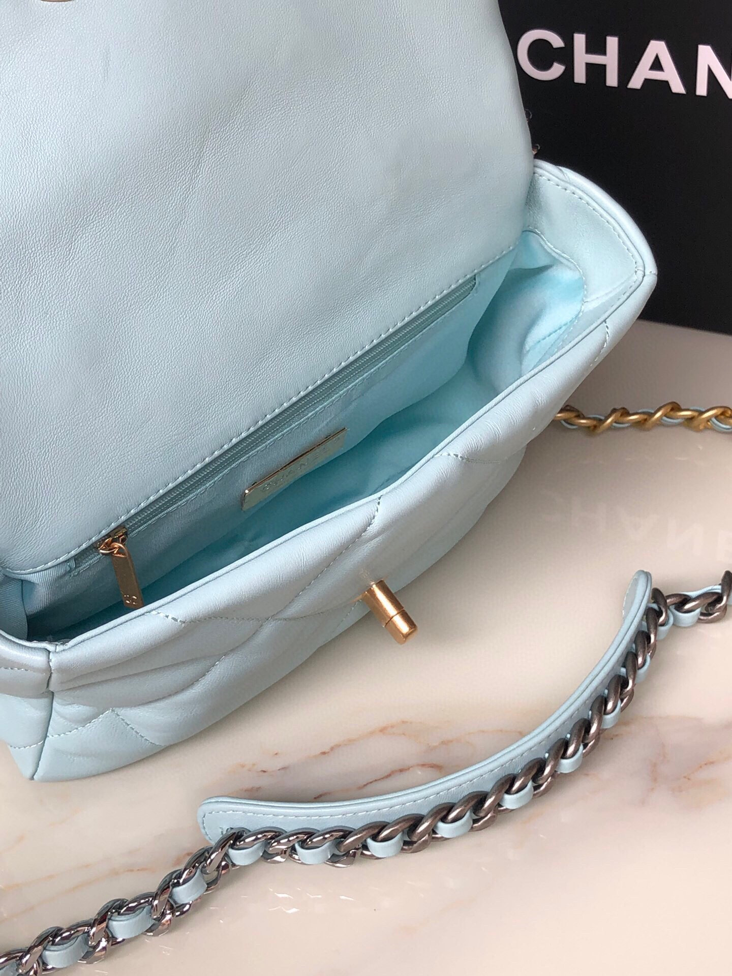 CHANEL 19 HANDBAG Shiny Leather, Gold-Tone, Silver-Tone & Ruthenium-Finish Metal Light Blue 6.2 × 10.1 × 3.5 in