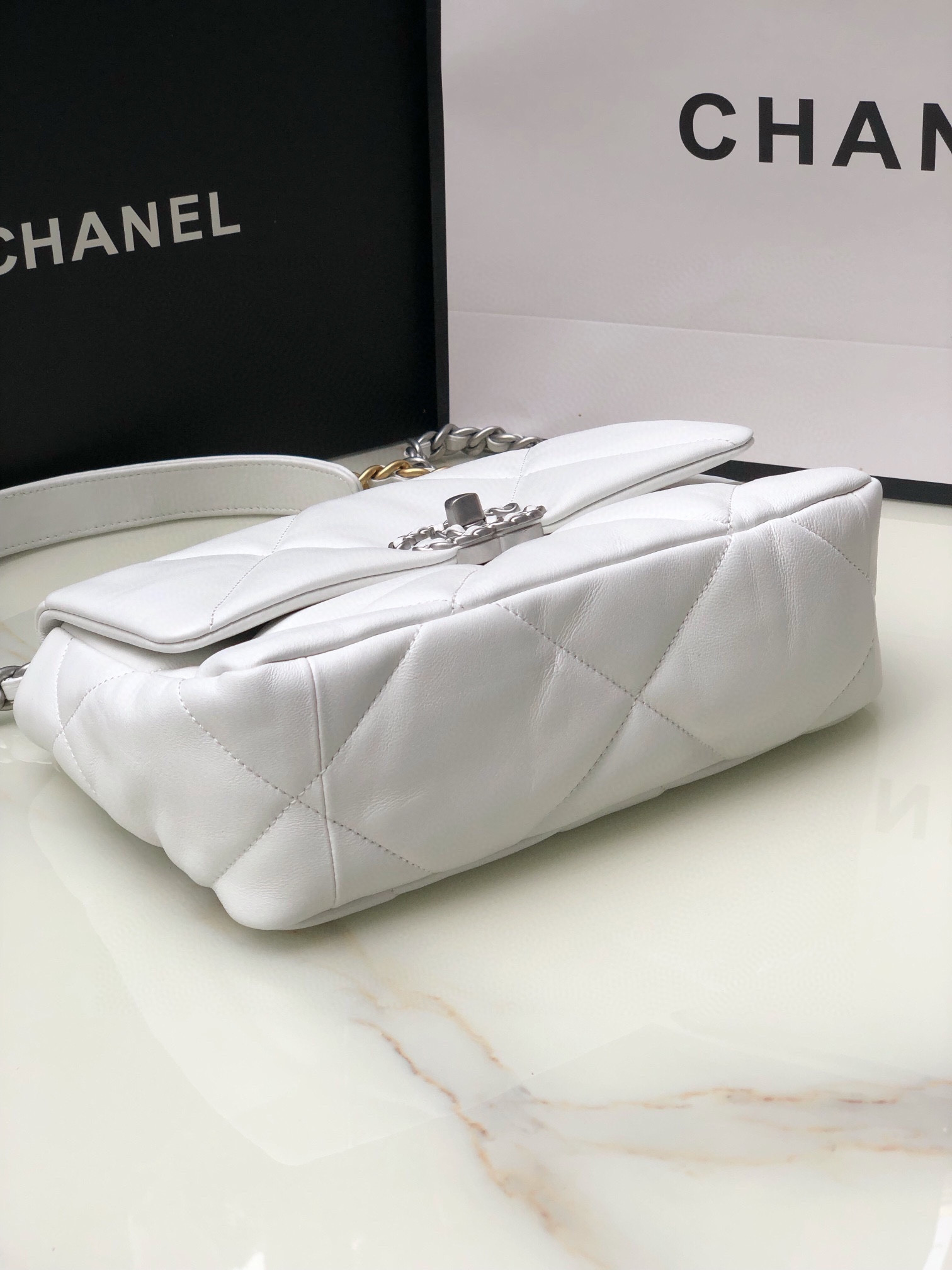 CHANEL 19 HANDBAG Shiny Leather, Gold-Tone, Silver-Tone & Ruthenium-Finish Metal White 6.2 × 10.1 × 3.5 in
