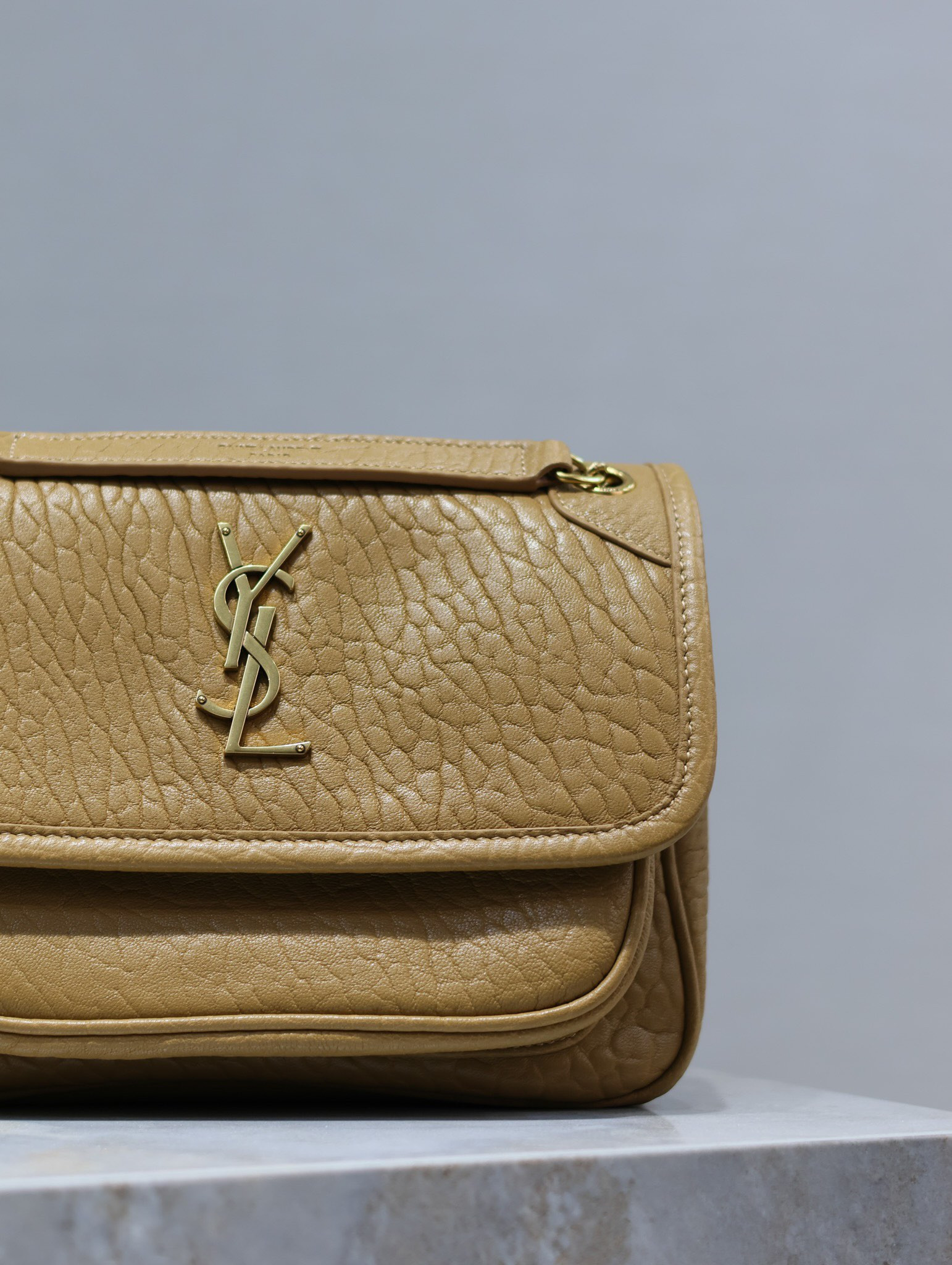 YSL NIKI BABY IN VINTAGE LEATHER DARK CORK 8.2 X 6 X 2.9 INCHES
