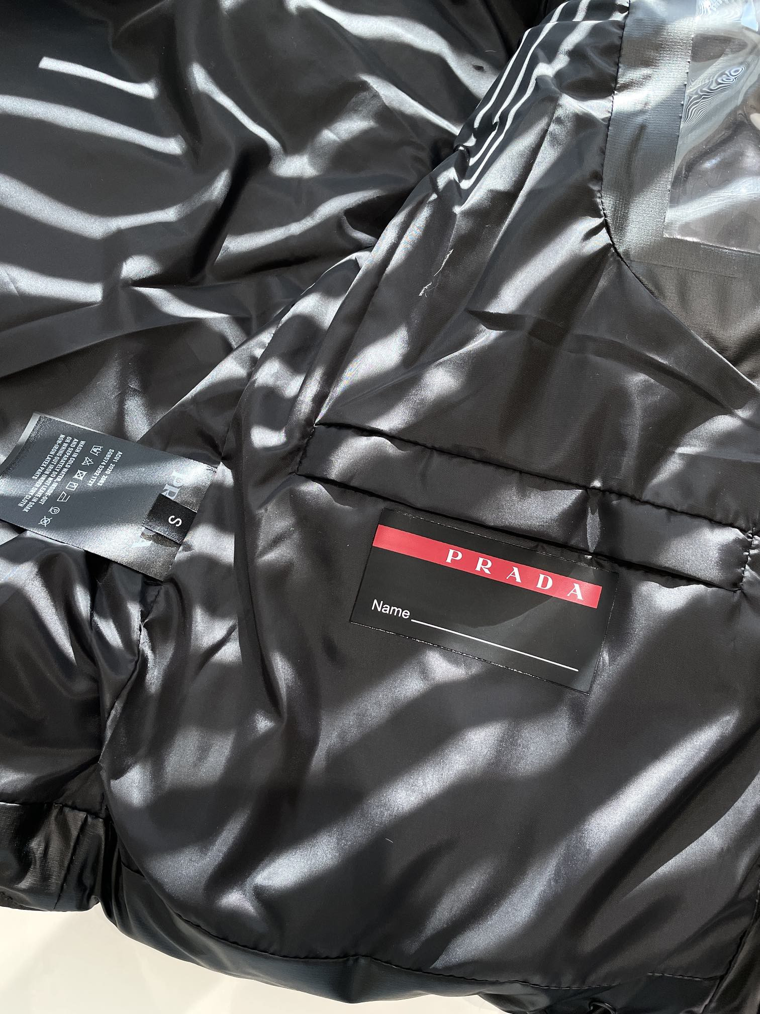 Prada Light Re-Nylon hooded puffer jacket