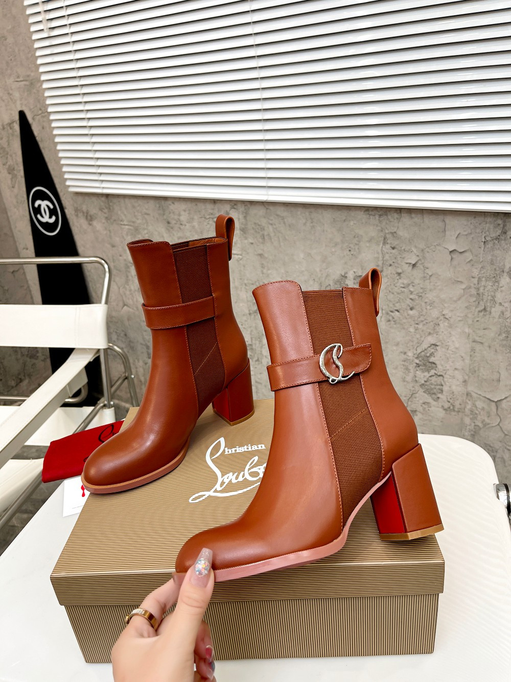 UA Christian Louboutin (CL) launched a new collection of chunky heeled platform boots