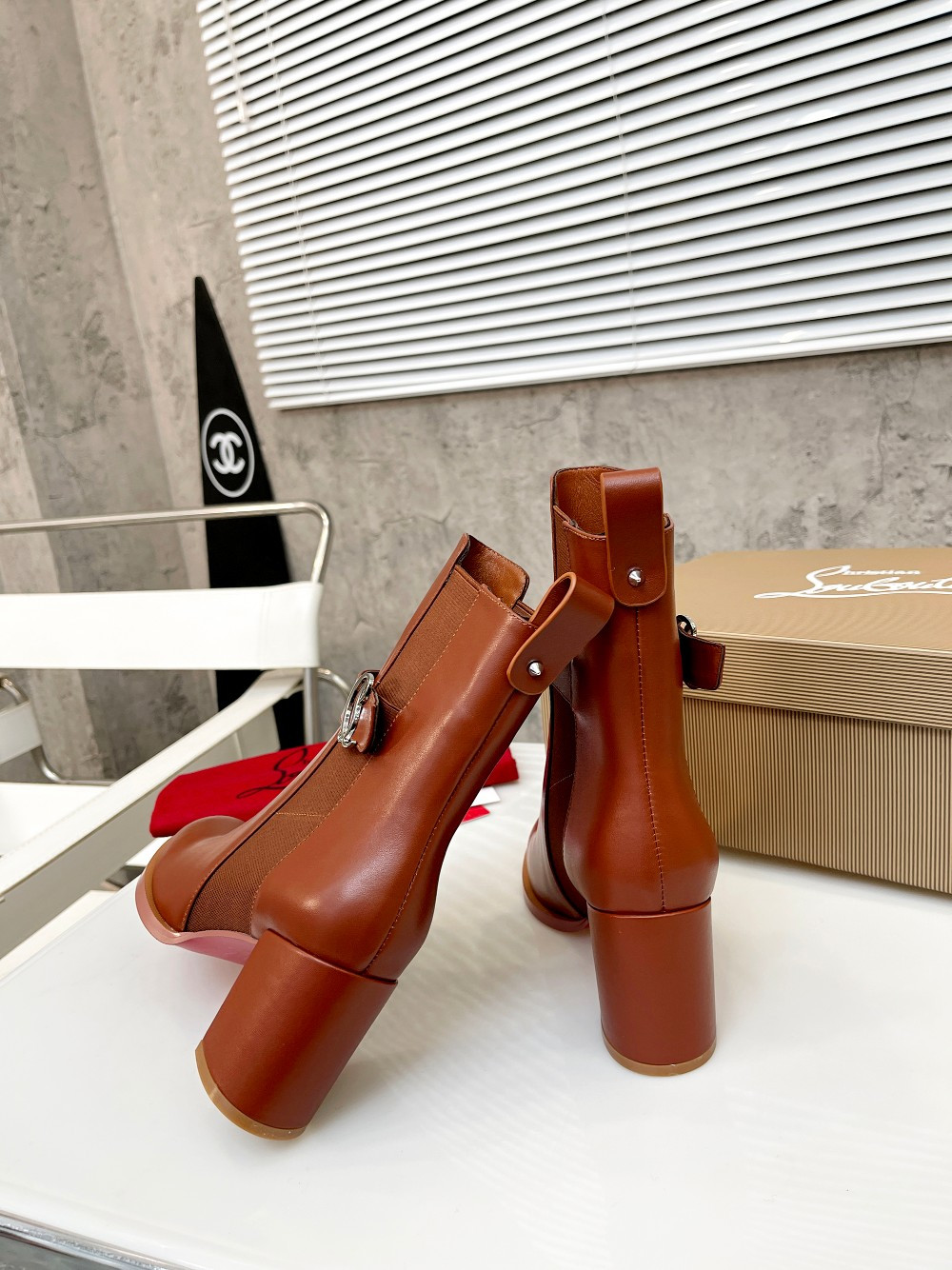 UA Christian Louboutin (CL) launched a new collection of chunky heeled platform boots