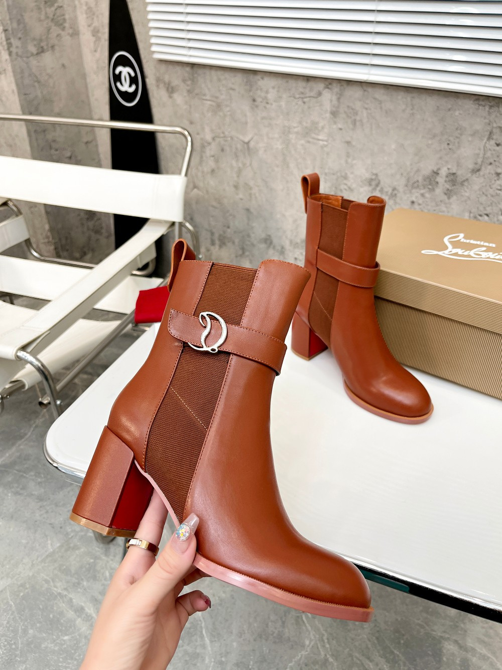 UA Christian Louboutin (CL) launched a new collection of chunky heeled platform boots