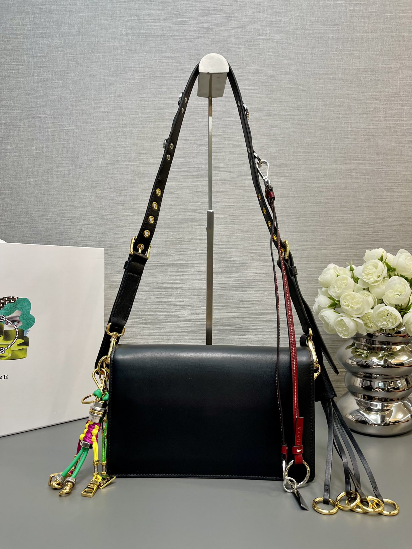 Prada Soft Sound small leather shoulder bag with charm 13.5x24x6cm