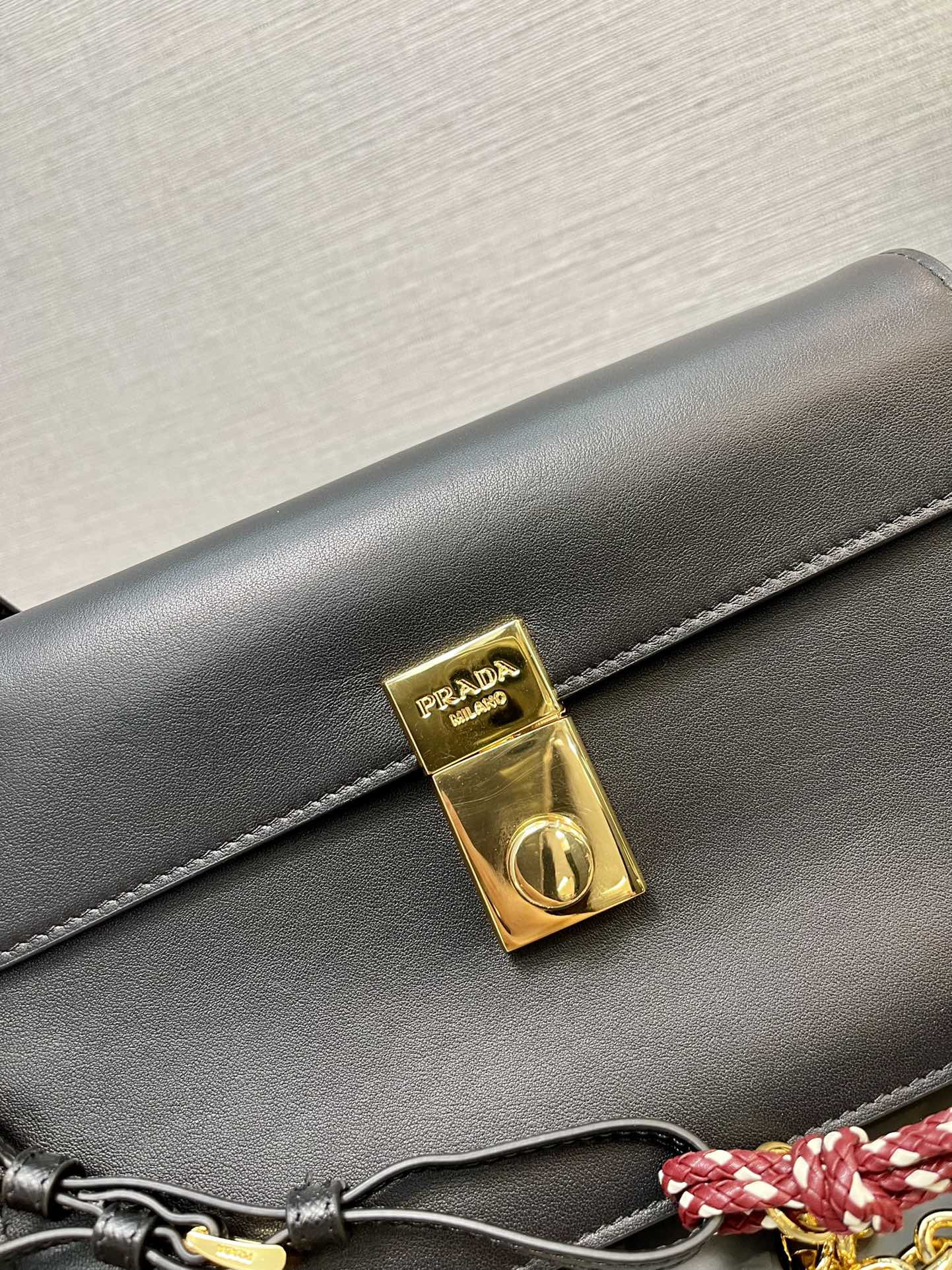 Prada Soft Sound small leather shoulder bag with charm 13.5x24x6cm